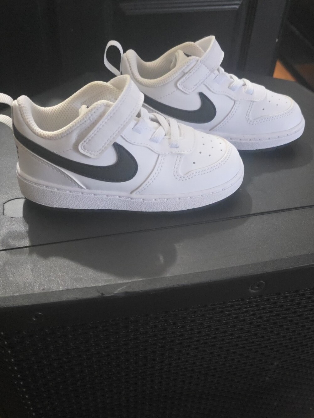 Nike Kids White Sneakers with Black Swoosh